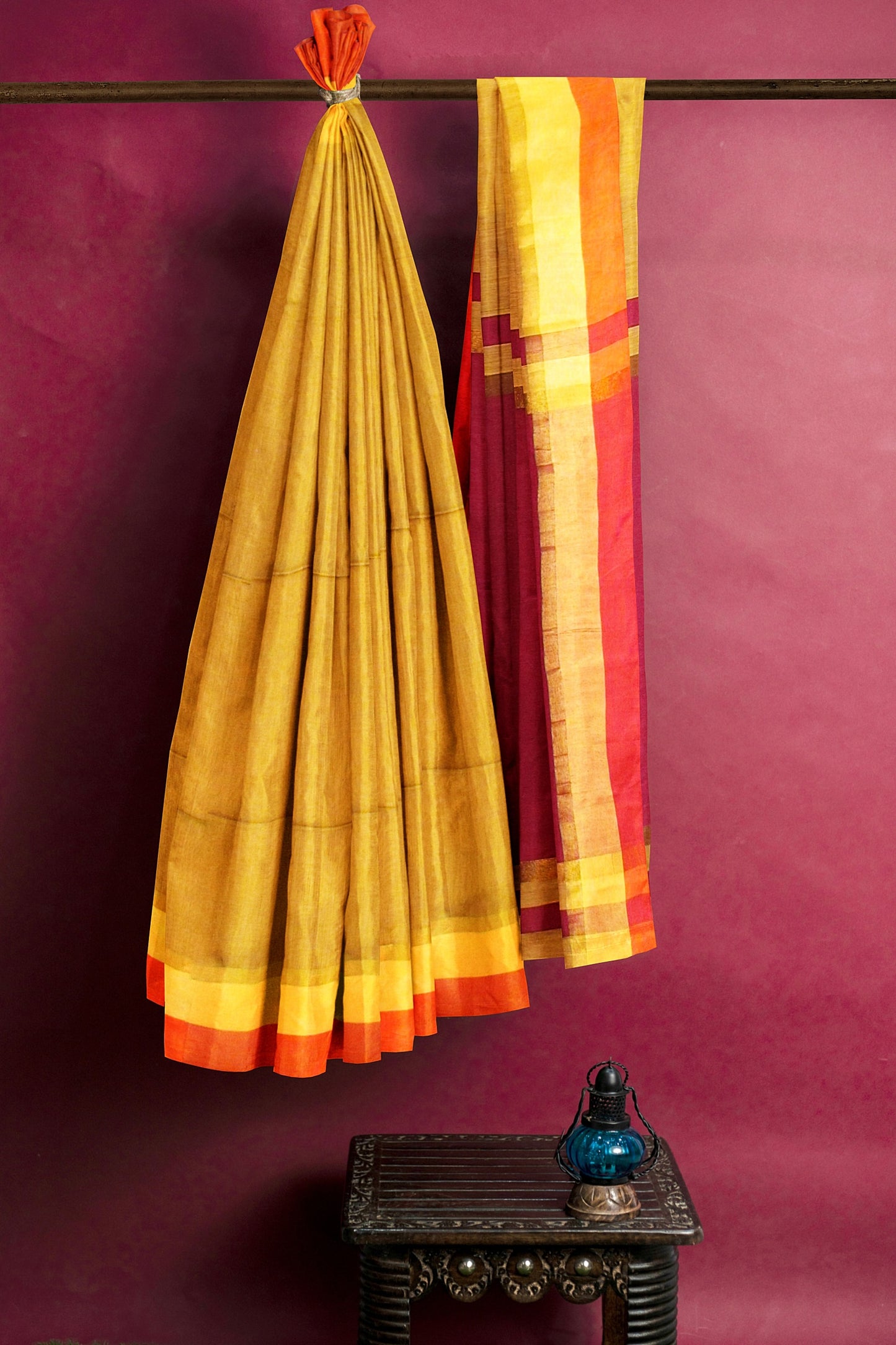 Gold and maroon colored silk saree
