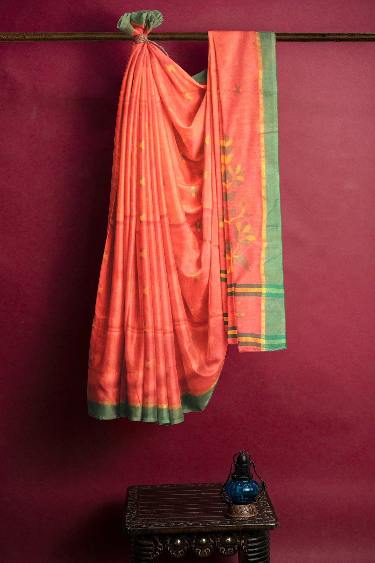 A fine peach and orange colored saree on a cotton base