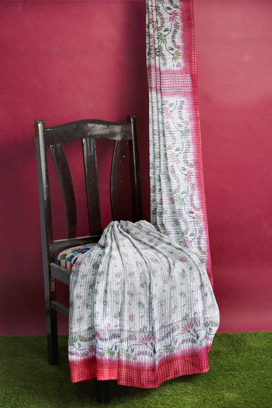 A handloom saree on a grey base and a red border