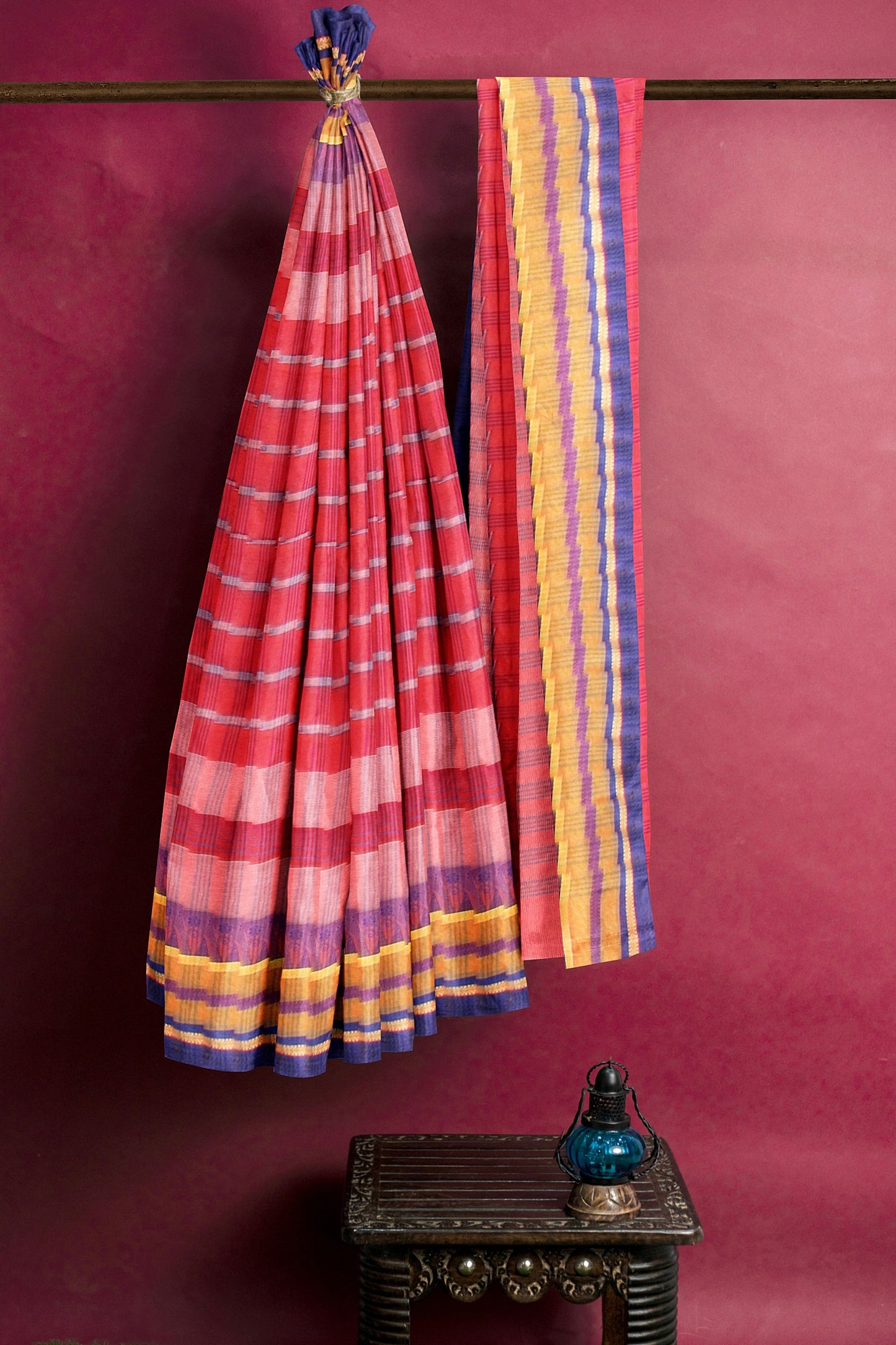 The red, pink and blue tant saree
