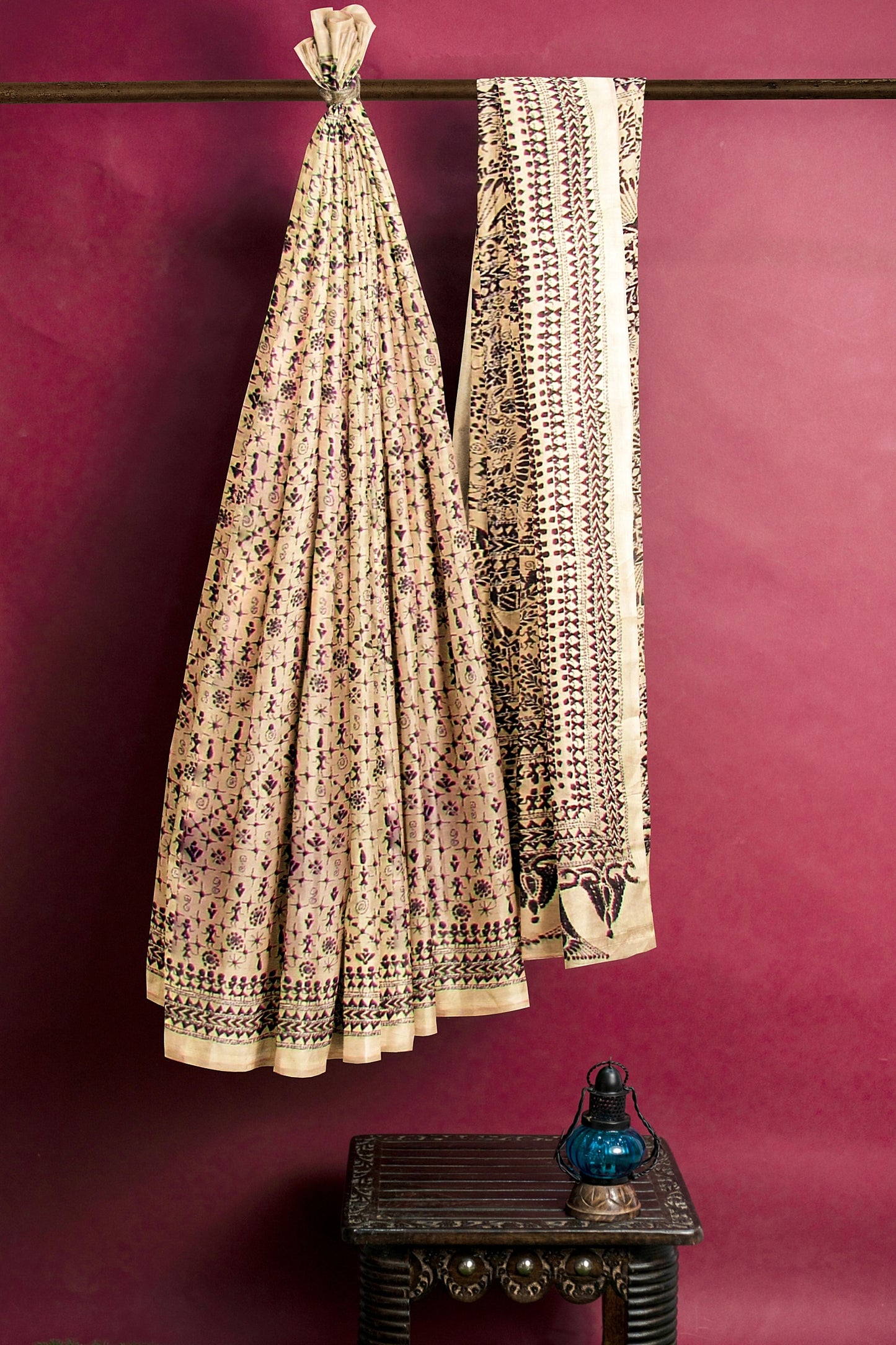 Embroidered silk saree on an off white base