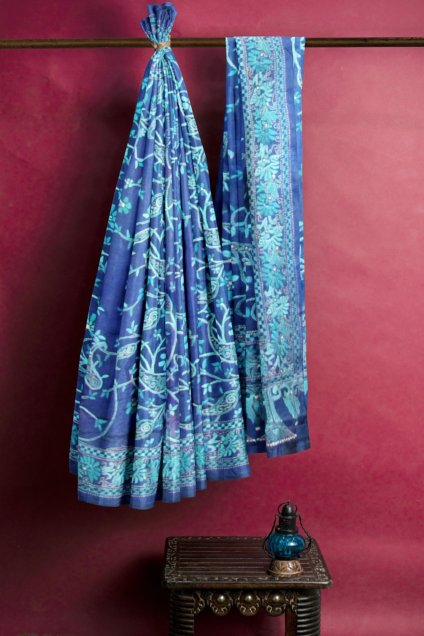A blue and green embroidered silk saree