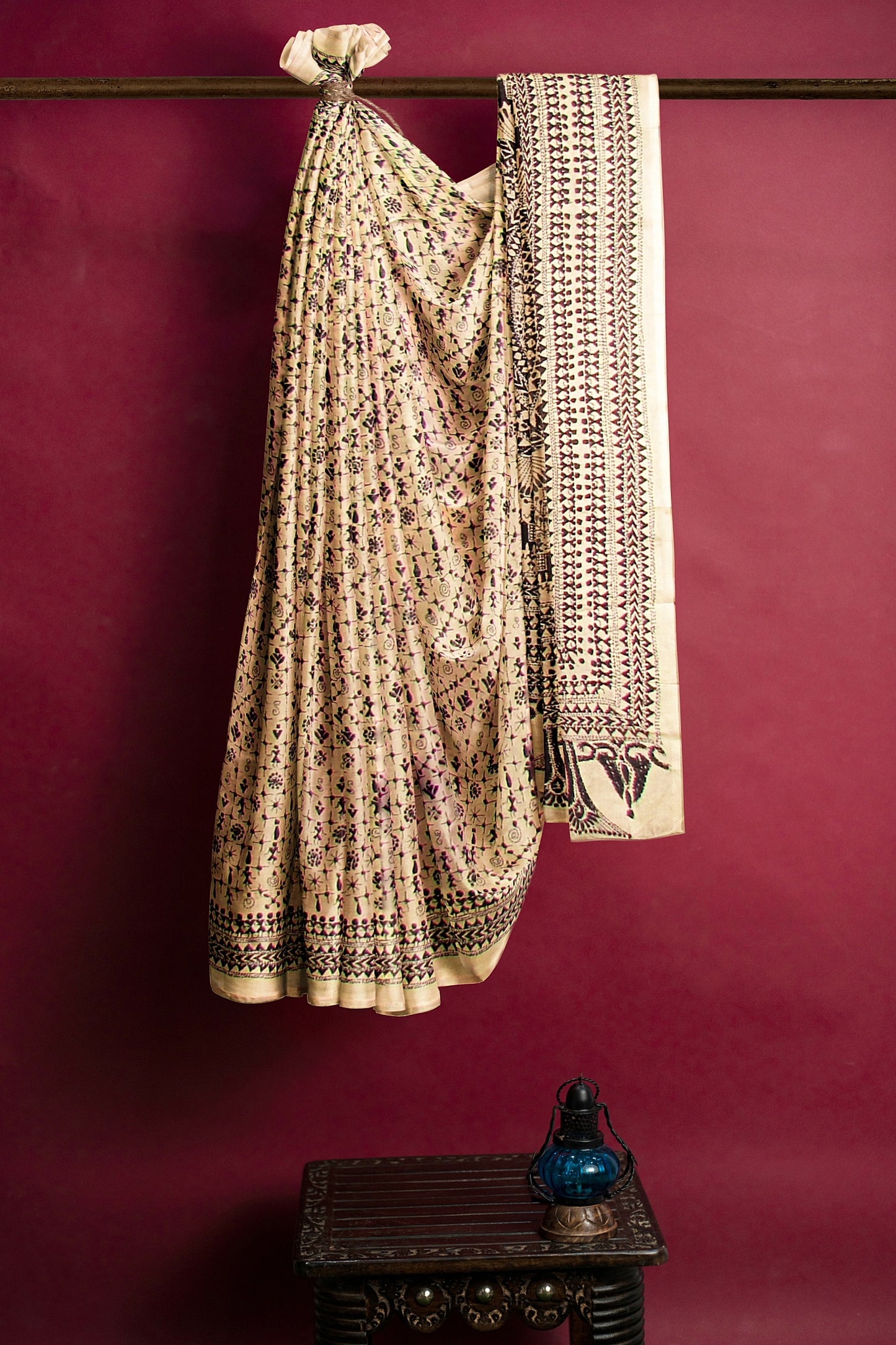 Embroidered silk saree on an off white base
